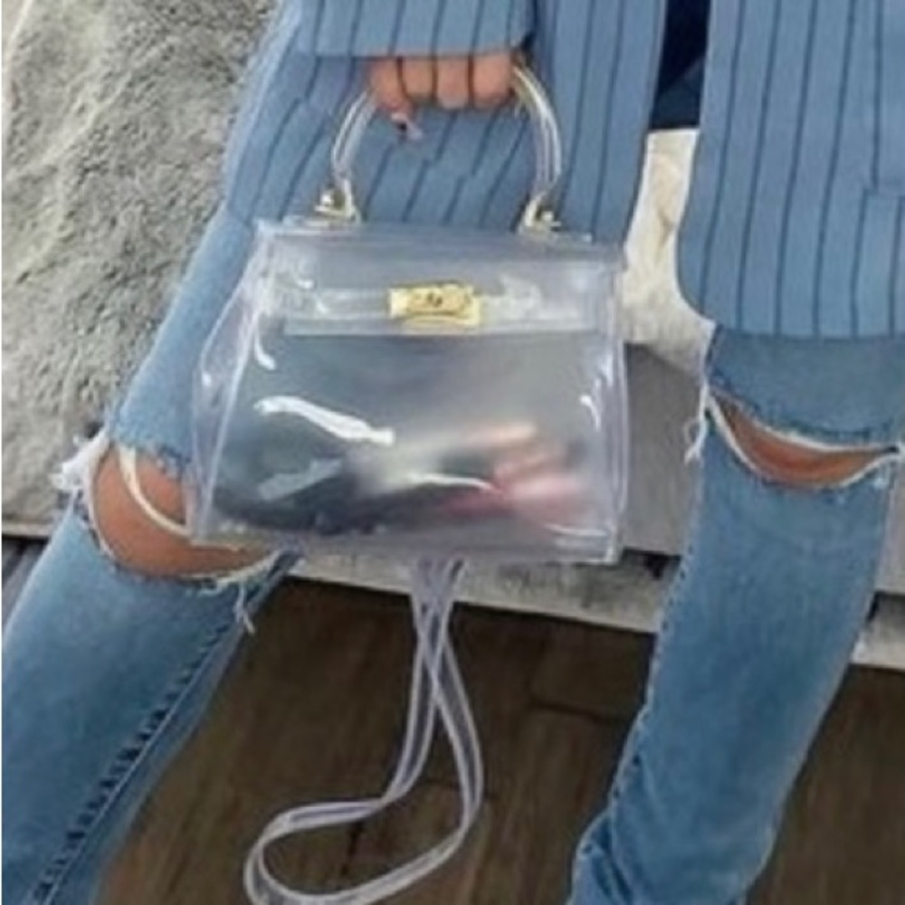 Brand new clear PETA and Jane clutch.